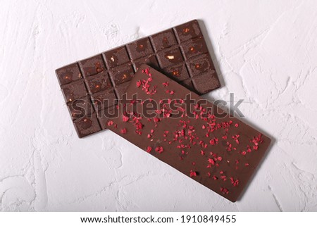 Similar – Image, Stock Photo Chocolate bar on cocoa powder pile. Chocolate and ingredients