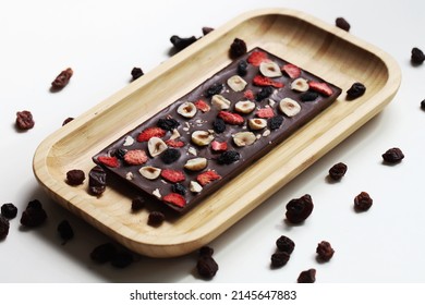 Handmade chocolate.chocolate with hazelnuts and sublimated strawberries.