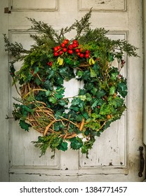 Handmade Christmas Wreath On Rustic Door