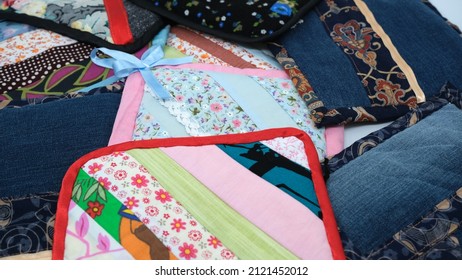 
handmade colorful patchwork trivets on a white background