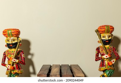 Handmade Colorful Wooden Rajasthani Doorkeeper Or Guard Souvenir Standing With Plain Background.