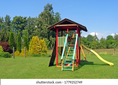 Handmade colorful wooden tower on children playground.                               