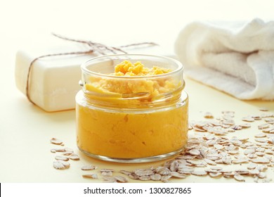 Handmade Cosmetics, Organic Fruit  Mask In Glass Jar, Soap And Sea Sponge On Wooden Table