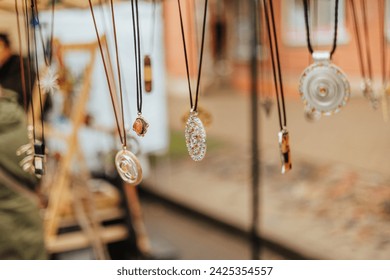 handmade craftmans jewelry display at market - Powered by Shutterstock