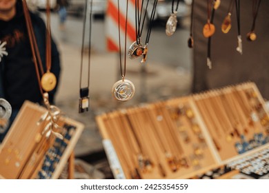 handmade craftmans jewelry display at market - Powered by Shutterstock