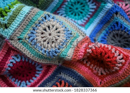 Handmade crochet blanket in a beautiful array of colors.