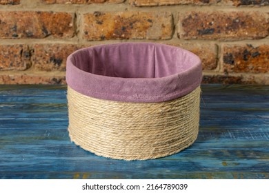 Handmade Cylindrical Basket On A Blue Rustic Table