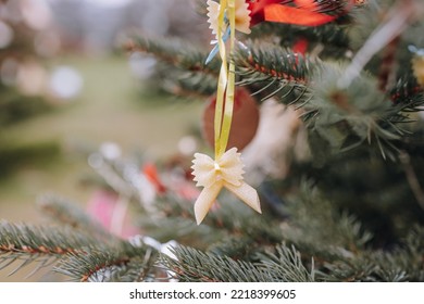 Handmade Decoration Made Of Farfalle Pasta And Penne Pasta On A Christmas Tree. DIY Ideas. Environment, Holiday Cooking And Italian Recipes Concept. Selective Focus, Copy Space, No Snow Outdoor