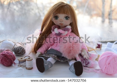 handmade doll in pink clothes and accessories