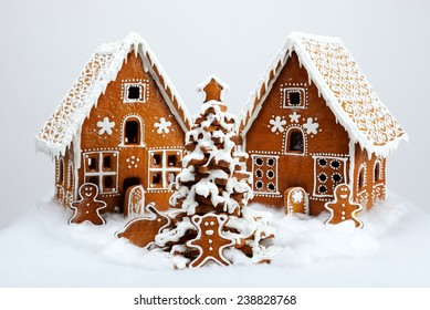 The hand-made eatable gingerbread houses and New Year Tree with snow decoration