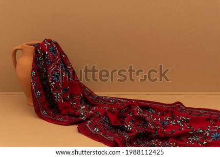 Handmade embroidered cashmere shawl with beautiful background and stump Stok fotoğraf © 