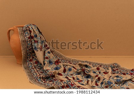 Handmade embroidered cashmere shawl with beautiful background and stump Stok fotoğraf © 