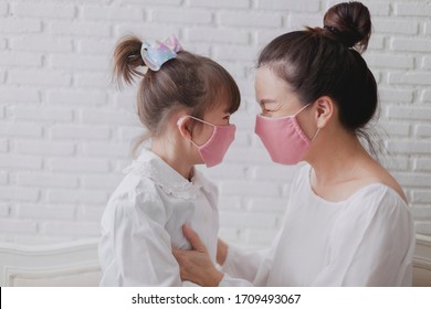 Handmade Fabric Mask For Protect PM 2.5 And Virus. Portrait. Mother And Daughter Are Happy To Wearing Handmade Fabric Mask. 