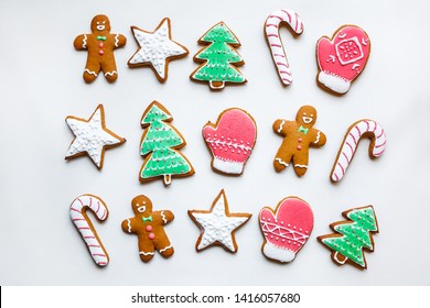 Handmade Festive Gingerbread Cookies In The Form Of Stars, Snowflakes, People, Socks, Staff, Mittens, Christmas Trees, Hearts For Xmas And New Year Holiday On White Paper Background