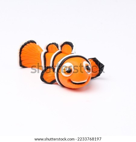 Handmade Figure fish Nemo From cartoon Modeling Plasticine on white 