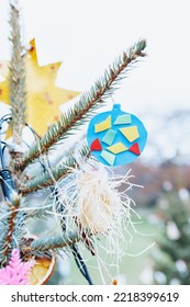 Handmade Foam And Paper Christmas Decorations On Christmas Tree, Outdoors. DIY For Children. Environment, Recycle, Reuse, Upcycling, Zero Waste Concept. Selective Focus, No Snow Background