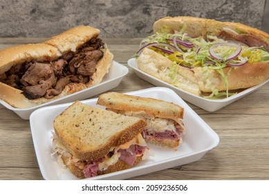 Handmade From Fresh Ingredients Deli Sandwiches With The Featured Reuben Corned Beef On Rye Bread In Front Of Tri Tip And Classic Italian Sub.