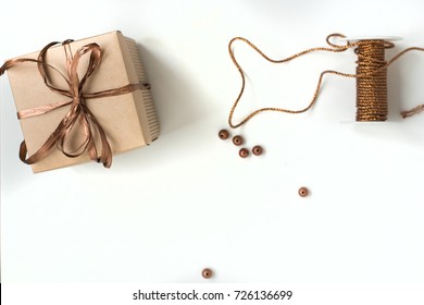 Handmade Gifts Wrapped In Paper Paper With A Bronze Ribbon