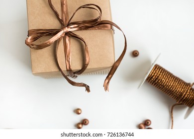 Handmade Gifts Wrapped In Paper Paper With A Bronze Ribbon