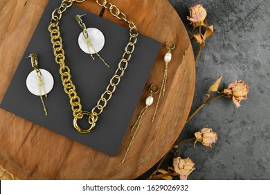 Handmade Gold Jewelry For Women. Jewelry For All Lovers. Chains On A Wooden Background. View From Above.