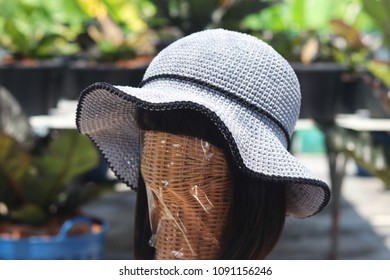 Handmade Gray Crochet Hat In Garden.