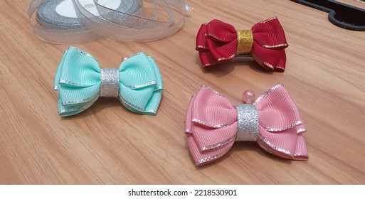 Handmade Grosgrain Ribbon Clips Hair Bow, Alligator Clip (Red, Turquoise And Pink Colors) With Wood Background. 