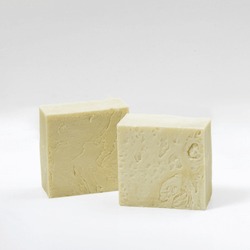 Handmade Hatay Olive Oil Laurel Soap Against A White Background. Green Yellow Cream Colored
