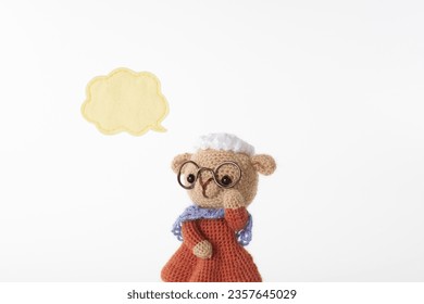 Handmade knitted toy. cute and small animal Amigurumi .speech bubble - Powered by Shutterstock