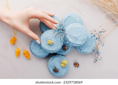 Handmade light blue soap with flowers on fabric, close-up - Shutterstock ID 2329718069