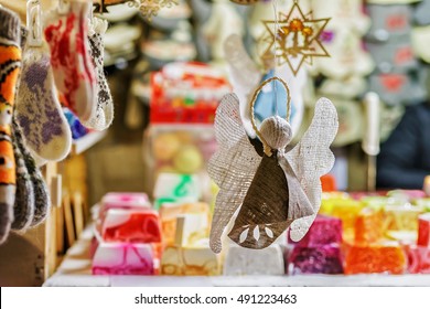 Handmade linen angel figure hanging at one of the stalls during the Christmas market in old Riga, Latvia. At the fair people can find festive souvenirs, goods, warm clothes and traditional food.