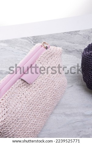Handmade macrame bags are available in dark and light colors. Eco-friendly natural macrame cotton crossbody bag. Hobby knitting handmade macrame. Modern summer concept.