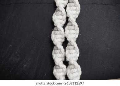 Handmade macrame on space background.
