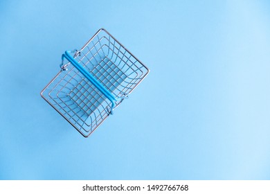 Handmade Metal Basket For Shopping At The Supermarket On A Blue Background.  Store Concept.  View From Above