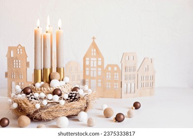 Handmade modern advent wreath with four candles lit every sunday before christmas. Traditional diy xmas decoration