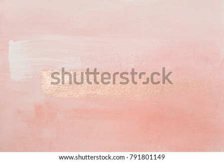 Handmade modern subtle pink abstract painted background texture with shiny metallic golden brush stroke