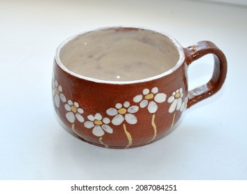 Handmade Mug Made Of Clay With A Pattern Of Daisies