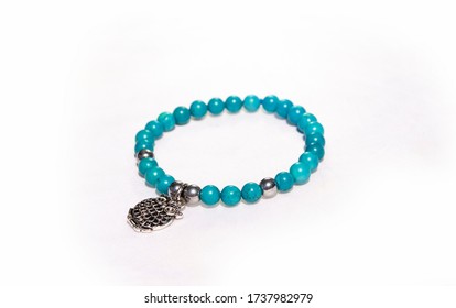 Handmade Natural Female Bead Bracelets On White Isolated Background. Blue Agates With Silver And Owl Charm