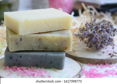 Handmade natural soap on wooden background. Spa natural treatments. organic natural soap with body brush, oil bottle and cotton towel, spa and wellness products. - Powered by Shutterstock