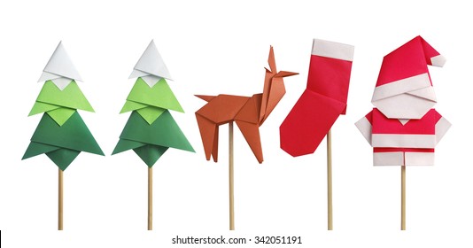 Handmade origami paper craft Santa Claus, green Christmas trees, reindeer and stocking
isolated on white - Powered by Shutterstock