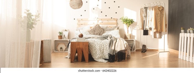 Handmade Pallet Bed And Dotted Bedroom Wall