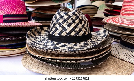 Handmade Panama Hats Or Paja Toquilla Hat Or Sombrero At The Traditional Outdoor Market In Cuenca, Ecuador. Popular Souvenir From South America