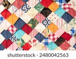Handmade patchwork cushions, made up of various colors and patterns detail. using fabric from the textile industry, as used to be done in the old days with so-called patchwork pillows. flat lay. retro