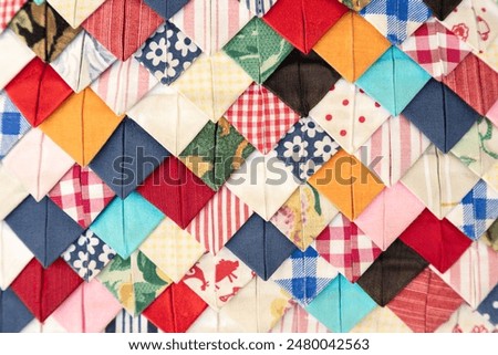 Handmade patchwork cushions, made up of various colors and patterns detail. using fabric from the textile industry, as used to be done in the old days with so-called patchwork pillows. flat lay. retro