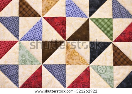 Handmade Patchwork quilt as background. Flower print. Color blanket in style patchwork.