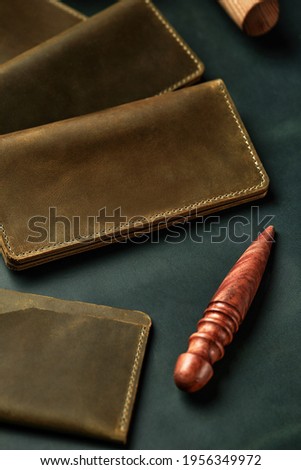 Handmade products made of genuine yellow and red leather. Leather passport cover, leather wallet. Leather goods for men. The view from the top