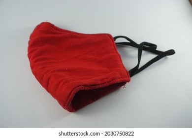 Handmade Red Cloth Mask On A White Background