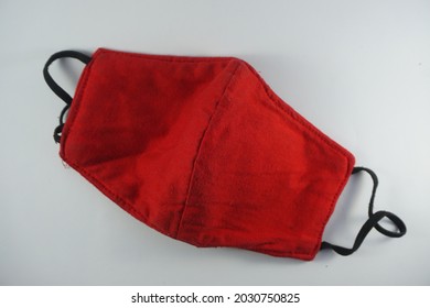 Handmade Red Cloth Mask On A White Background