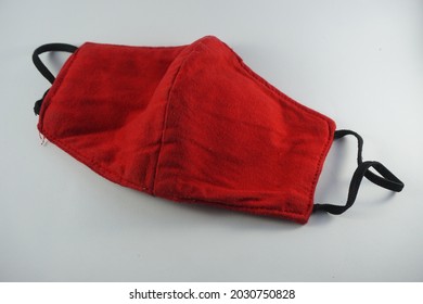 Handmade Red Cloth Mask On A White Background