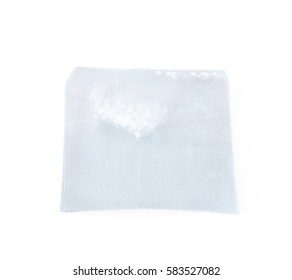 Handmade semi-transparent bar of soap isolated over the white background - Shutterstock ID 583527082