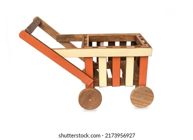 Handmade small wooden cart with four wheels painted putting items for decoration in the garden isolated on white background. - Shutterstock ID 2173956927